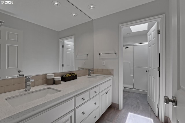 1811 NW Rosefinch Ln, Portland, OR 97229 - bathroom featuring a shower stall, double vanity, recessed lighting, tasteful backsplash, and toilet