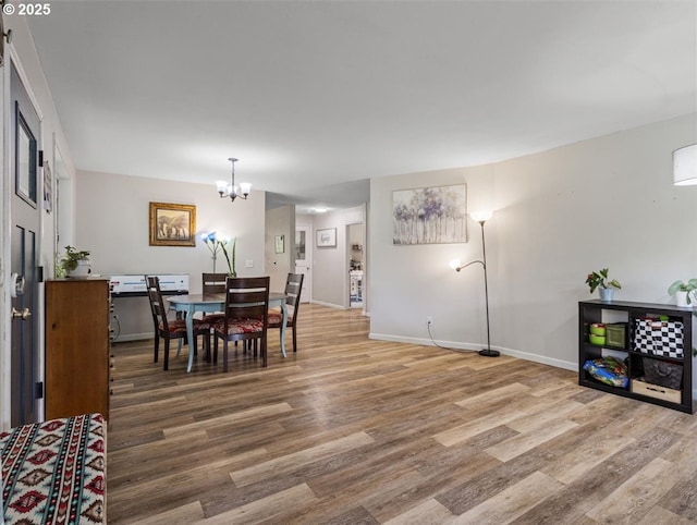 17610 SE 362nd Dr, Sandy, OR 97055 - dining space with wood finished floors, a chandelier, and baseboards