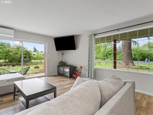 17610 SE 362nd Dr, Sandy, OR 97055 - living room with a wall unit AC, baseboards, and light wood-type flooring