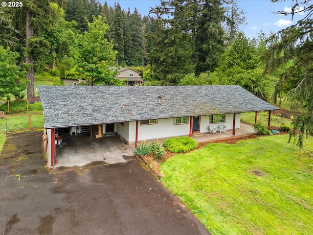 17610 SE 362nd Dr, Sandy, OR 97055 - view of front of home featuring driveway, covered porch, a carport, a front yard, and a wooded view