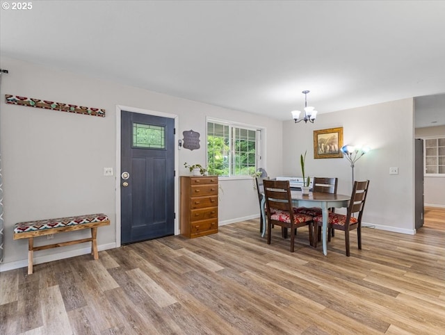 17610 SE 362nd Dr, Sandy, OR 97055 - dining area featuring light wood-type flooring, a chandelier, and baseboards