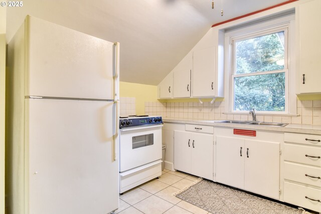 5120 NE Glisan St, Portland, OR 97213 - kitchen with black microwave, electric range, a sink, healthy amount of natural light, and lofted ceiling
