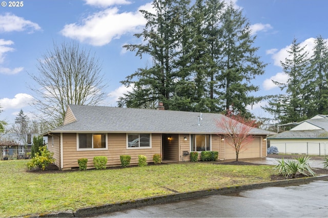 ranch-style home with a garage, a front lawn, and a shingled roof