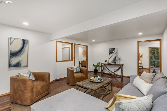 living room featuring dark wood-type flooring, recessed lighting, and baseboards