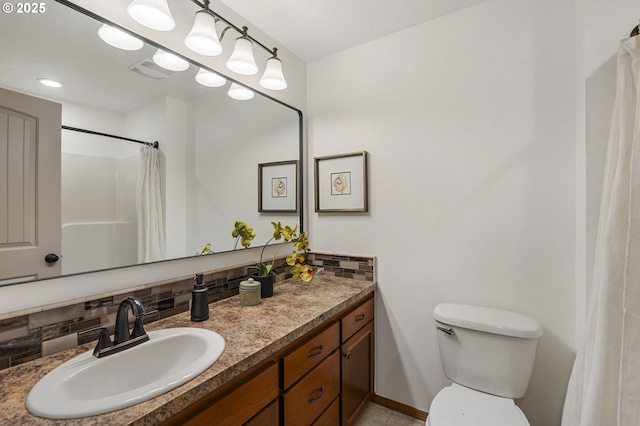 bathroom with decorative backsplash, a shower with curtain, vanity, and toilet