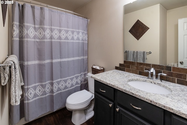 16050 Dick Rd, La Pine, OR 97739 - full bathroom featuring vanity, wood finished floors, tasteful backsplash, and curtained shower