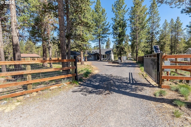 16050 Dick Rd, La Pine, OR 97739 - view of dirt / gravel driveway with a gate and a gated entry