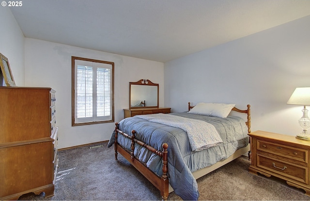 carpeted bedroom with visible vents and baseboards