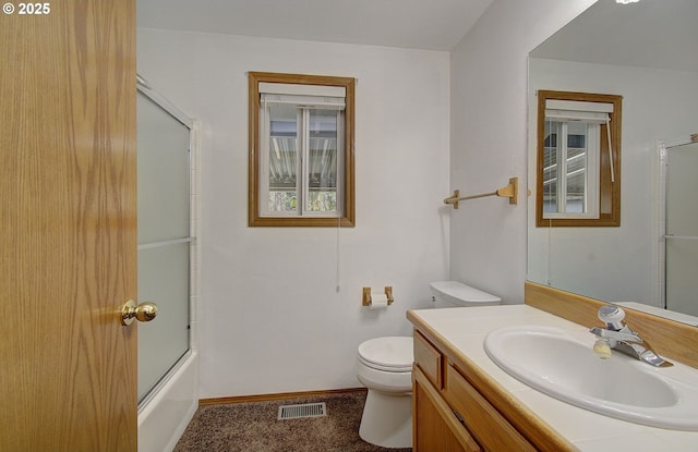 bathroom with baseboards, visible vents, bath / shower combo with glass door, toilet, and vanity