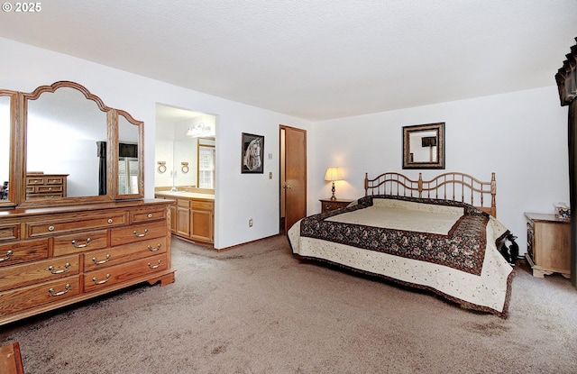 bedroom with carpet and connected bathroom