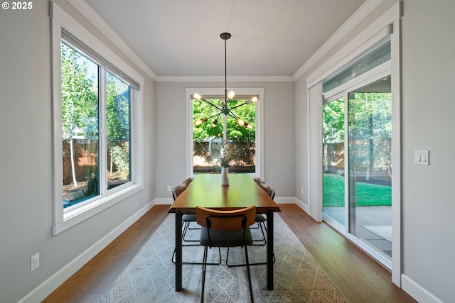 12721 Cottonwood Ave, Oregon City, OR 97045 - dining area with wood finished floors, crown molding, and a chandelier