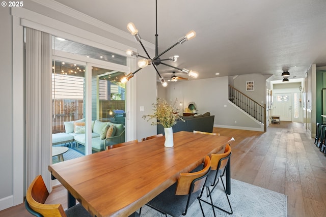 12721 Cottonwood Ave, Oregon City, OR 97045 - dining space with a chandelier, stairs, light wood-style floors, and ceiling fan
