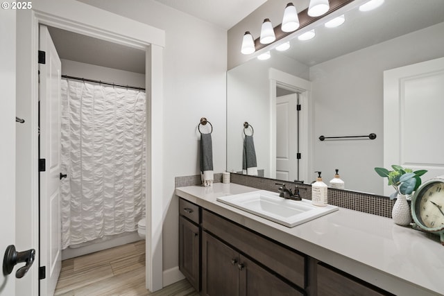 12721 Cottonwood Ave, Oregon City, OR 97045 - bathroom with vanity, a shower with curtain, and wood finished floors