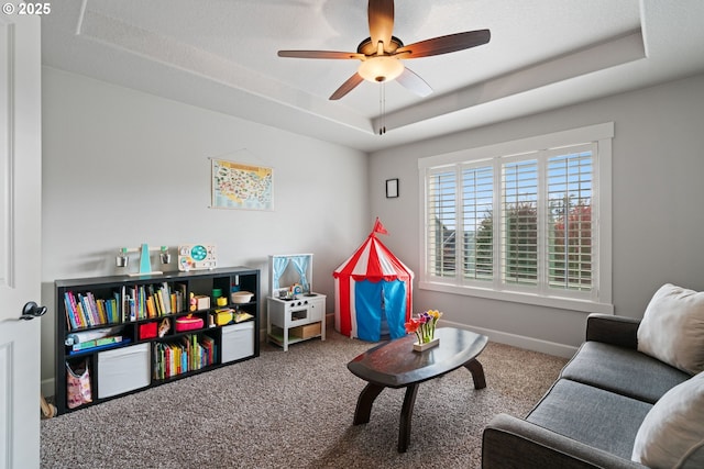 12721 Cottonwood Ave, Oregon City, OR 97045 - recreation room with a raised ceiling, carpet flooring, and a ceiling fan