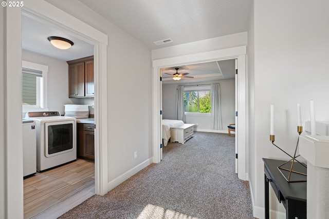 12721 Cottonwood Ave, Oregon City, OR 97045 - washroom featuring independent washer and dryer, cabinet space, ceiling fan, and light colored carpet