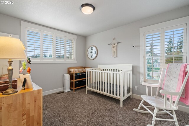 12721 Cottonwood Ave, Oregon City, OR 97045 - carpeted bedroom featuring multiple windows and a nursery area