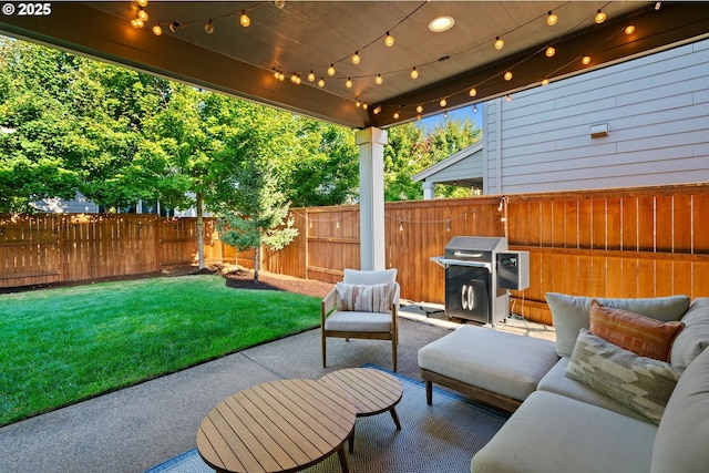 12721 Cottonwood Ave, Oregon City, OR 97045 - fenced backyard featuring a patio, a grill, and an outdoor hangout area