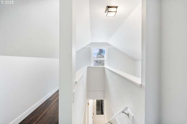 interior space with baseboards and wood finished floors