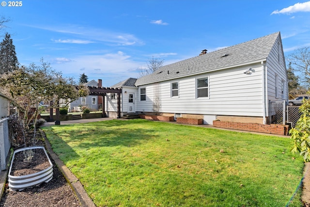 back of property with a lawn, a patio, roof with shingles, fence private yard, and a pergola