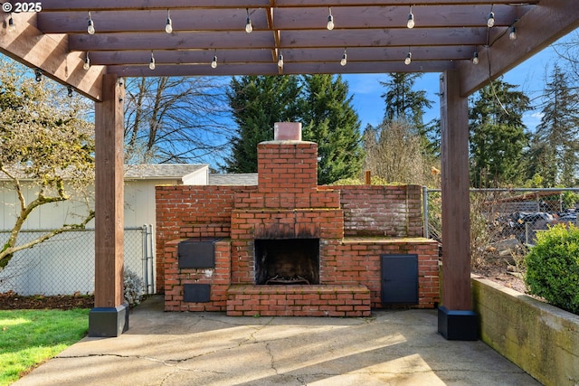 view of patio / terrace featuring an outdoor brick fireplace, fence, and a pergola