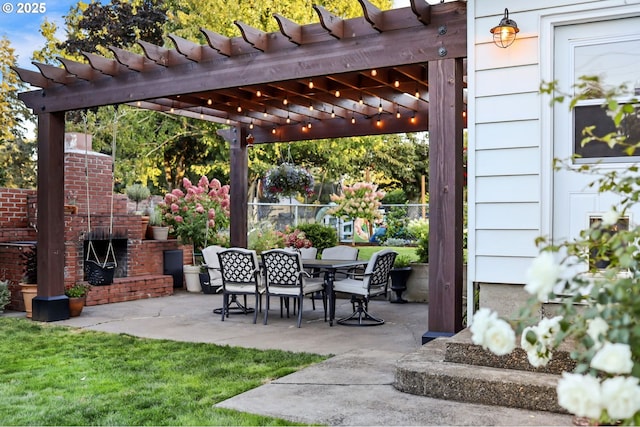 view of patio / terrace with an outdoor brick fireplace, outdoor dining space, and a pergola