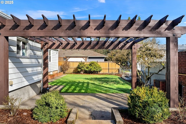 view of yard with a patio, fence, and a pergola