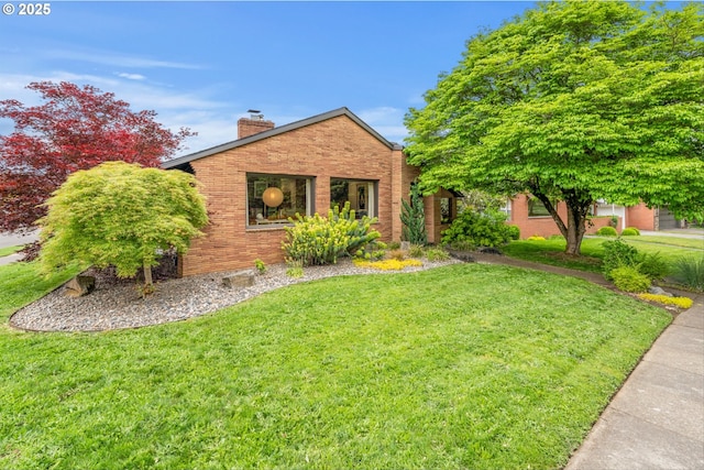 3905 NE Holman St, Portland, OR 97211 - view of front of property featuring brick siding, a front yard, and a chimney