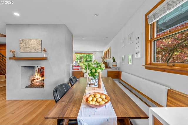 3905 NE Holman St, Portland, OR 97211 - dining area with wood finished floors, recessed lighting, and stairway