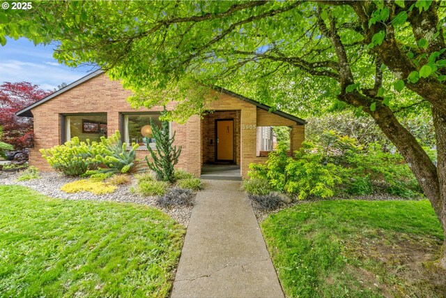 3905 NE Holman St, Portland, OR 97211 - view of front of property featuring brick siding and a front lawn