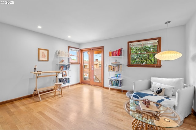 3905 NE Holman St, Portland, OR 97211 - sitting room with plenty of natural light, baseboards, wood finished floors, and recessed lighting