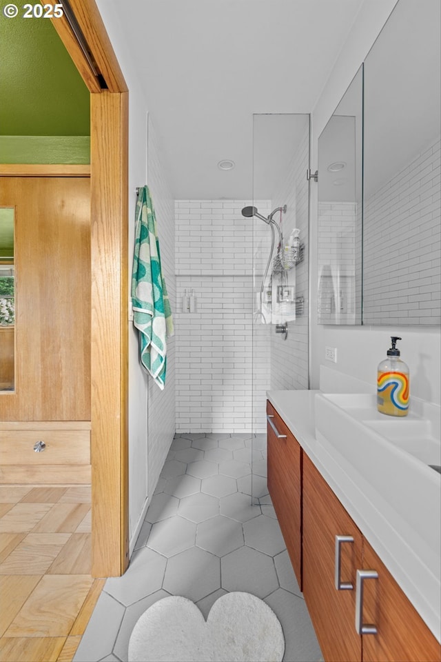 3905 NE Holman St, Portland, OR 97211 - bathroom featuring vanity, tile patterned flooring, and tiled shower