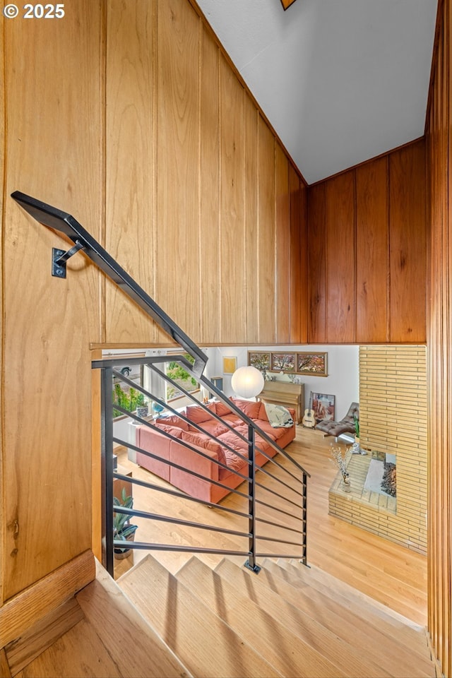 3905 NE Holman St, Portland, OR 97211 - staircase featuring wood finished floors and vaulted ceiling