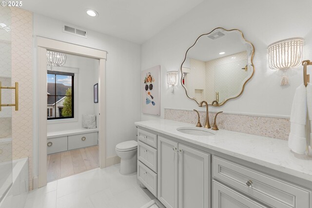 full bathroom with tile patterned floors, vanity, toilet, and tiled shower / bath