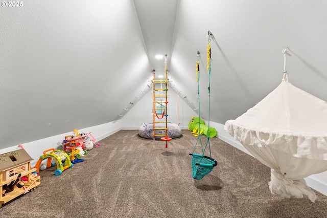 playroom with carpet flooring and lofted ceiling