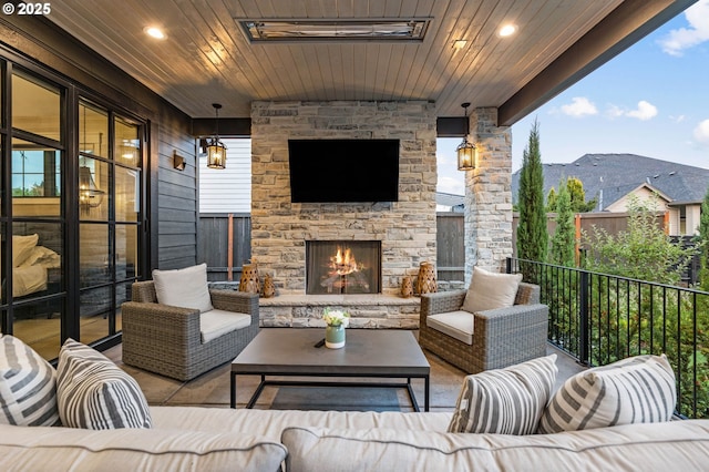 view of patio / terrace featuring an outdoor living space with a fireplace