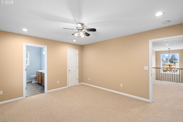 unfurnished bedroom with recessed lighting, baseboards, and light carpet