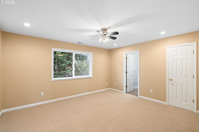 spare room featuring visible vents, recessed lighting, carpet, and ceiling fan