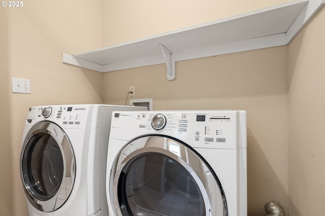 washroom featuring laundry area and washer and dryer