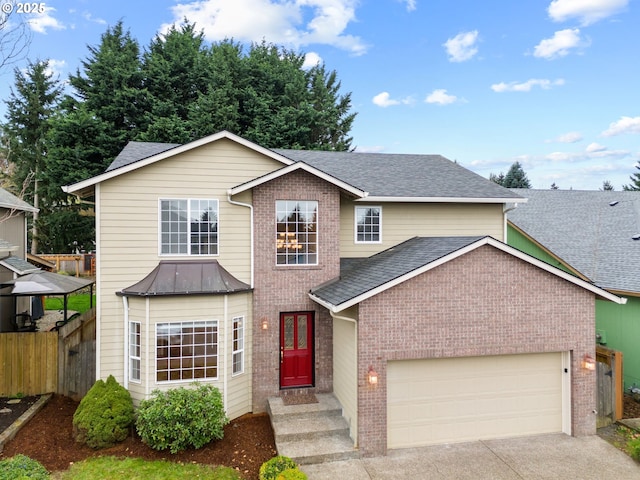 traditional-style home with fence, a shingled roof, an attached garage, brick siding, and concrete driveway