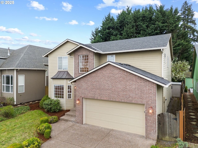 traditional-style house with driveway, a gate, brick siding, fence, and an attached garage