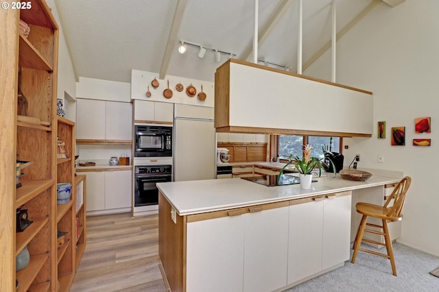 128 Del Prado St, Lake Oswego, OR 97035 - kitchen featuring black appliances, a peninsula, open shelves, white cabinets, and a textured ceiling