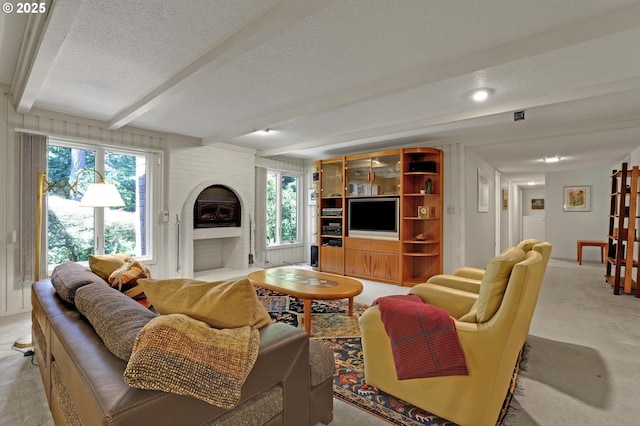 128 Del Prado St, Lake Oswego, OR 97035 - living room featuring beamed ceiling, a textured ceiling, a brick fireplace, and light carpet