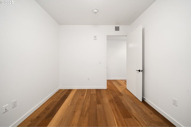 590 Waterfront Way Unit 500, Vancouver, WA 98660 - unfurnished room with wood finished floors, baseboards, and a smoke detector