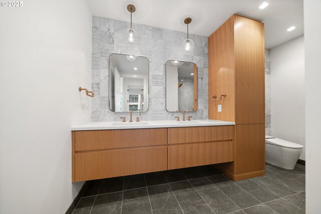 590 Waterfront Way Unit 500, Vancouver, WA 98660 - full bathroom with toilet, double vanity, and marble finish flooring