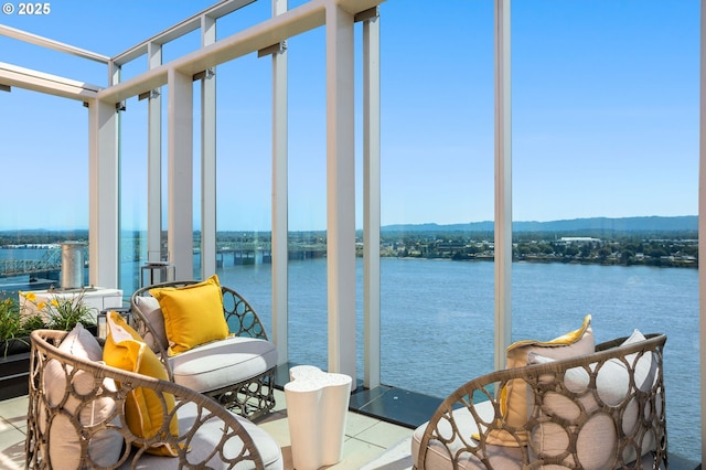 590 Waterfront Way Unit 500, Vancouver, WA 98660 - sunroom / solarium with a water view, floor to ceiling windows, and tile patterned flooring