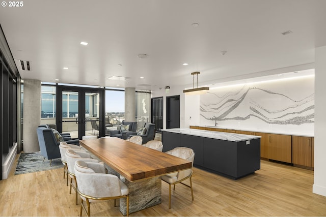 590 Waterfront Way Unit 500, Vancouver, WA 98660 - dining space with light wood finished floors, french doors, and recessed lighting