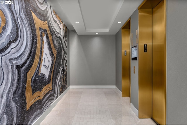 590 Waterfront Way Unit 500, Vancouver, WA 98660 - corridor featuring elevator, baseboards, recessed lighting, a raised ceiling, and tile patterned floors