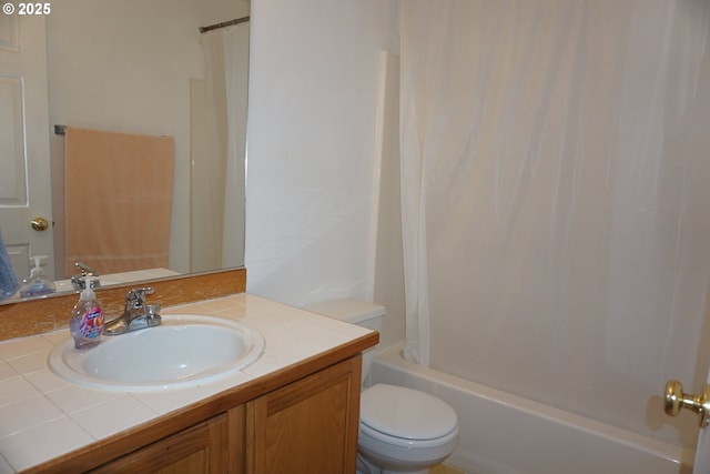 full bath featuring vanity, shower / bathtub combination with curtain, and toilet