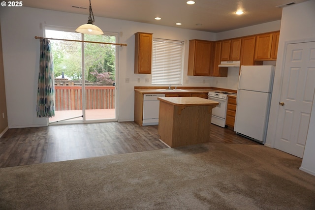 kitchen featuring a sink, white appliances, a center island, recessed lighting, and under cabinet range hood
