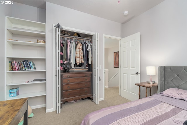 carpeted bedroom featuring a closet